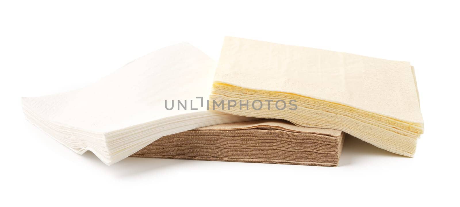 Beige paper napkins on white background studio shot close up