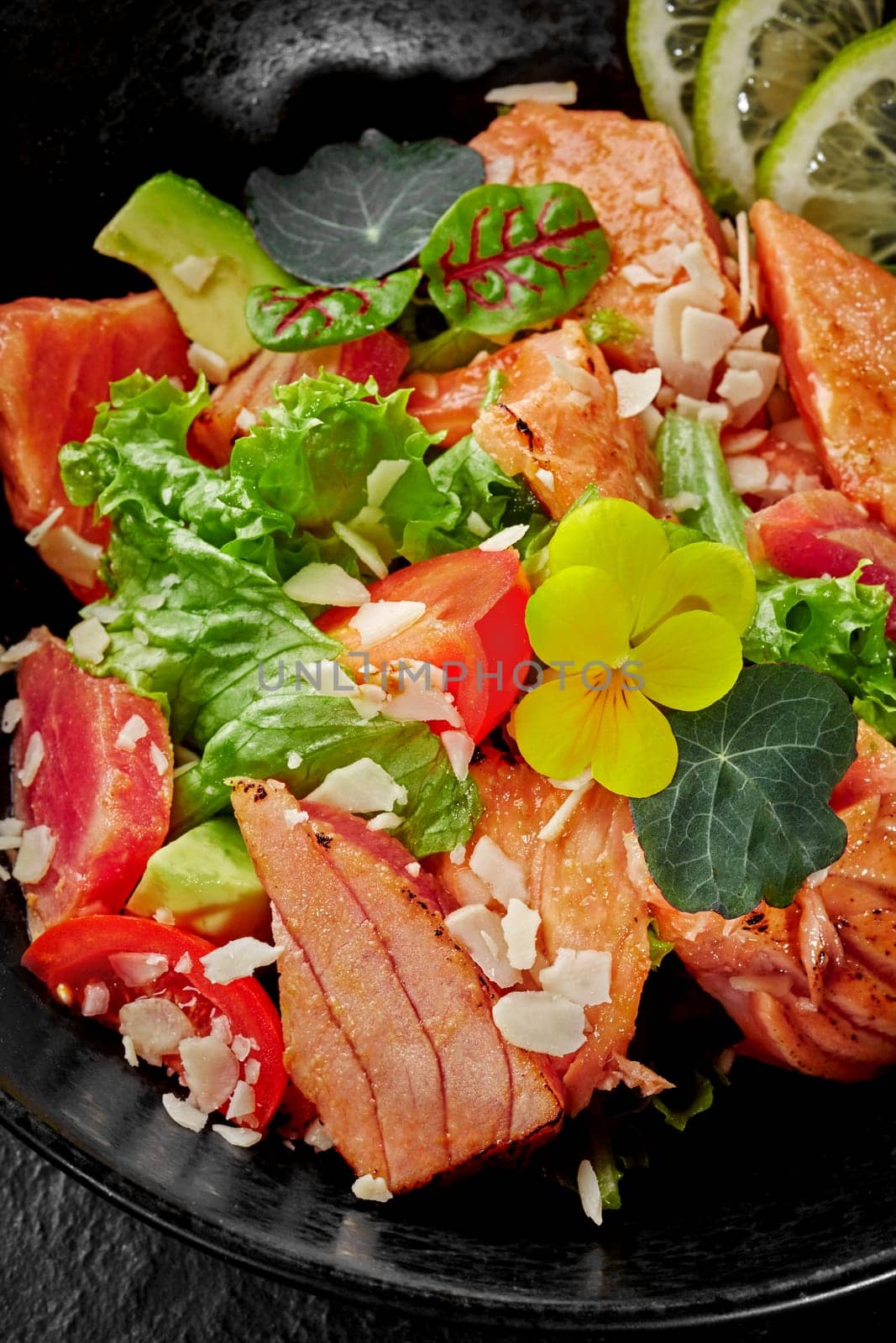 Seared ahi tuna salad with lettuce, tomatoes, avocado and Asian-style dressing by nazarovsergey