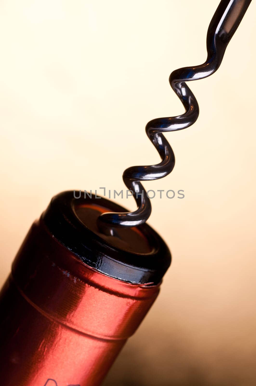 A spindle from a corkscrew in a cork of a wine bottle