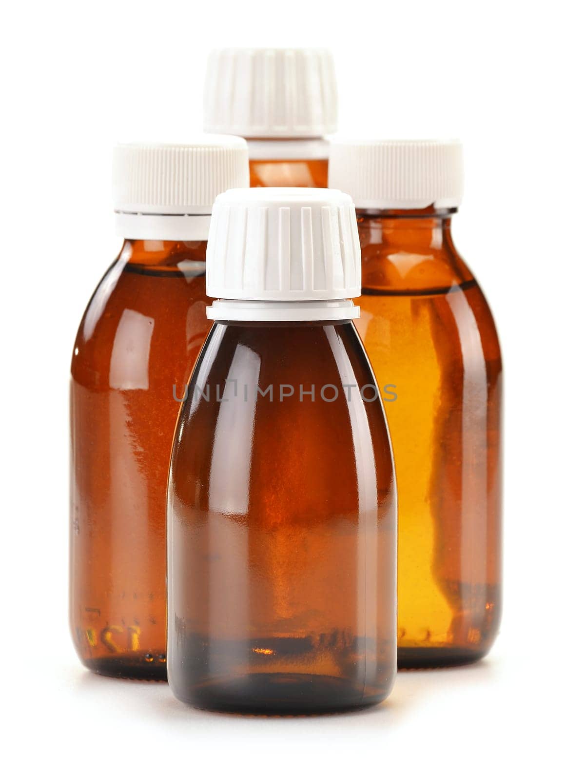 Bottles of syrup medication on white background