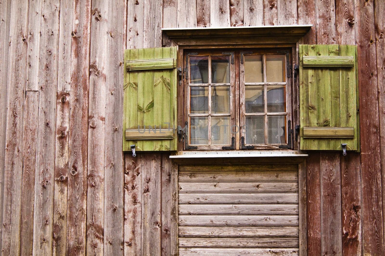 Old wooden window with shutters