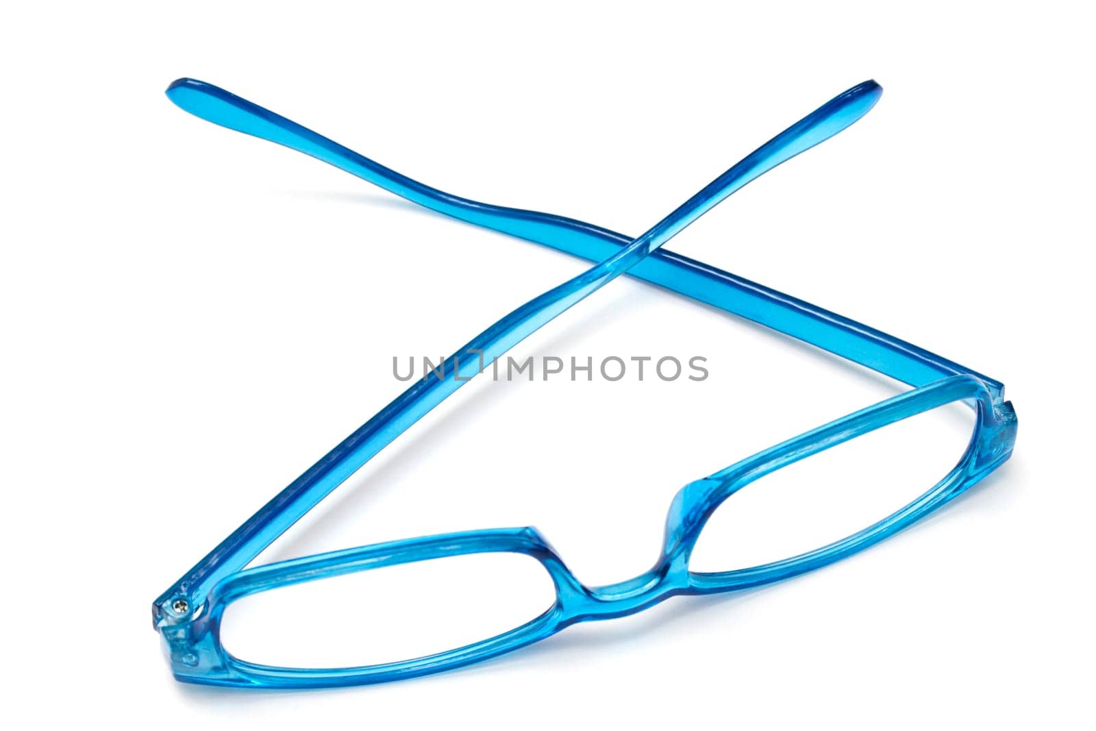 Beautiful blue glasses closeup on white background