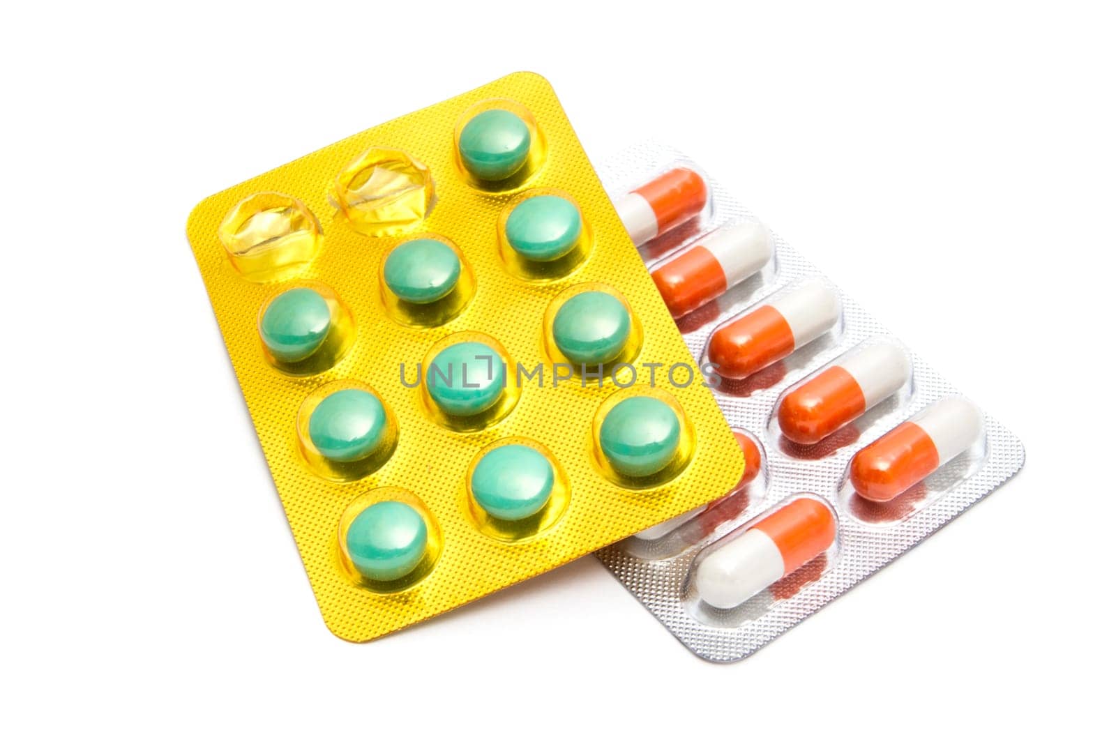 Colorful pills closeup on white background