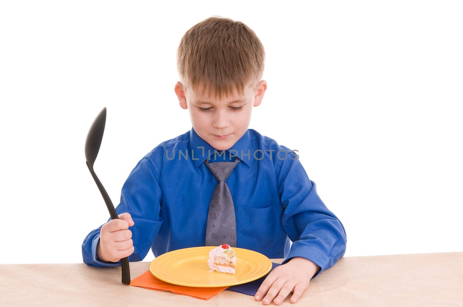 child with a large spoon isolated on white background