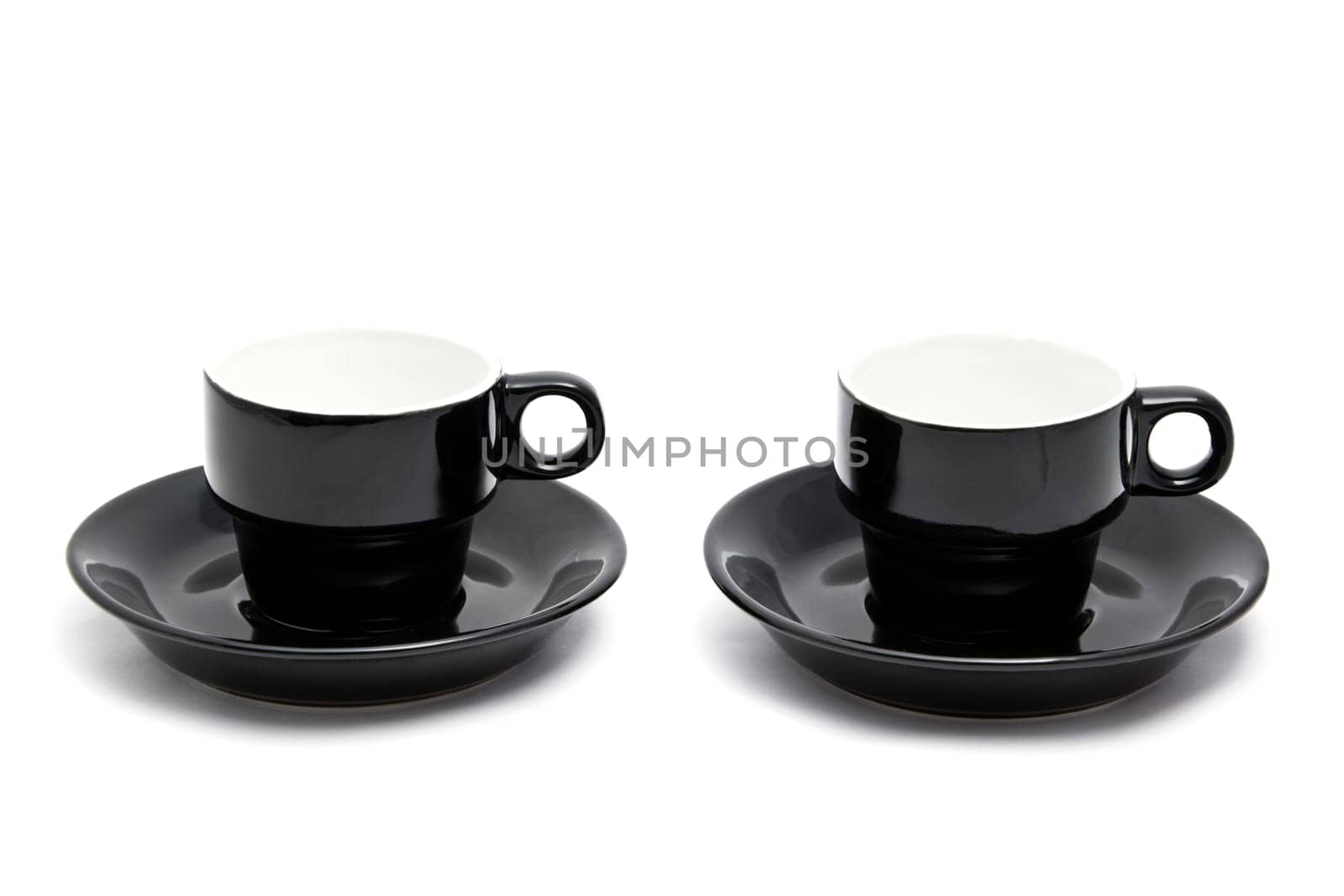 Black coffee cups closeup on white background