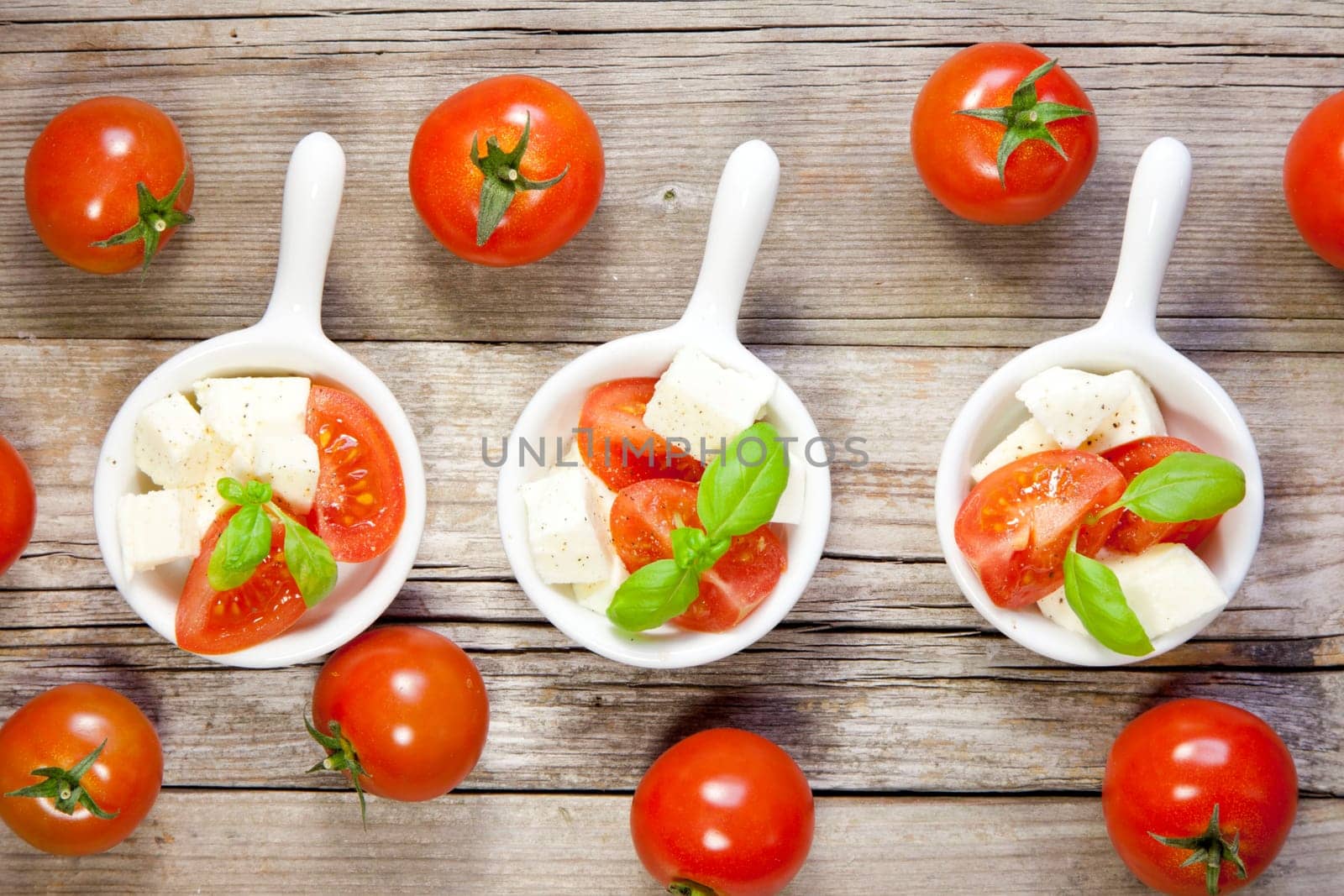 Italian salad with tomatos and mozarella cheese