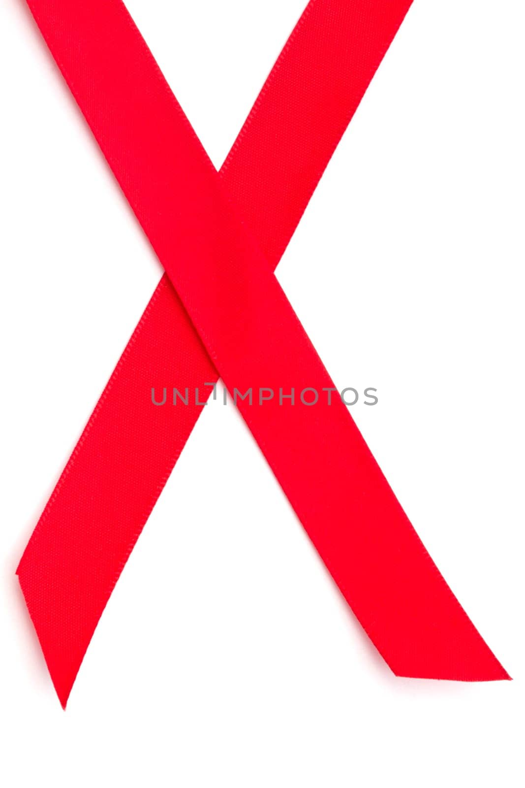 Red ribbon closeup on white background
