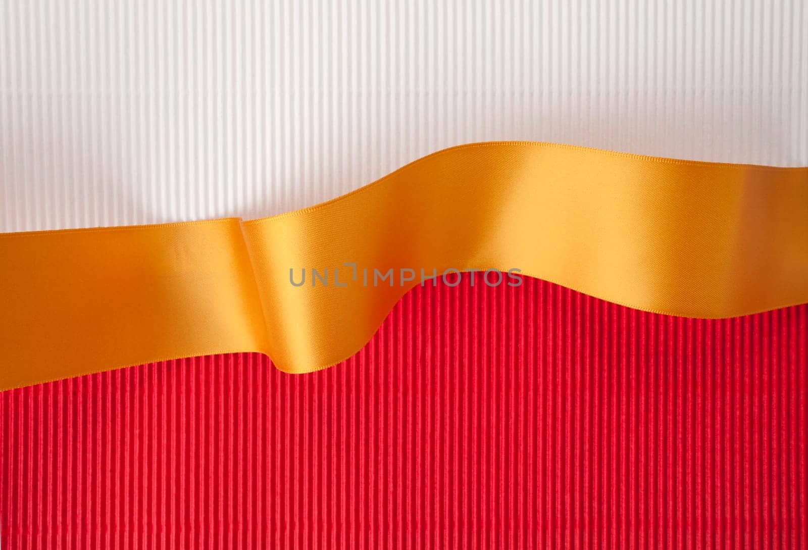 Gold ribbon banner on corrugated cardboard