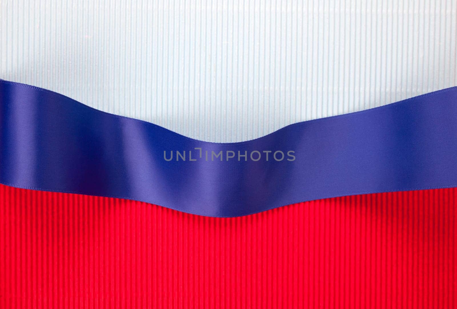 Blue ribbon banner on corrugated cardboard