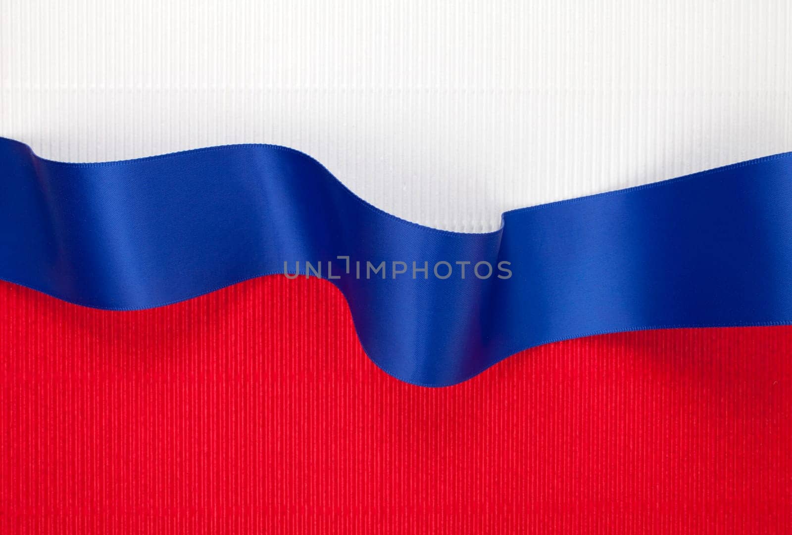 Blue ribbon banner on corrugated cardboard