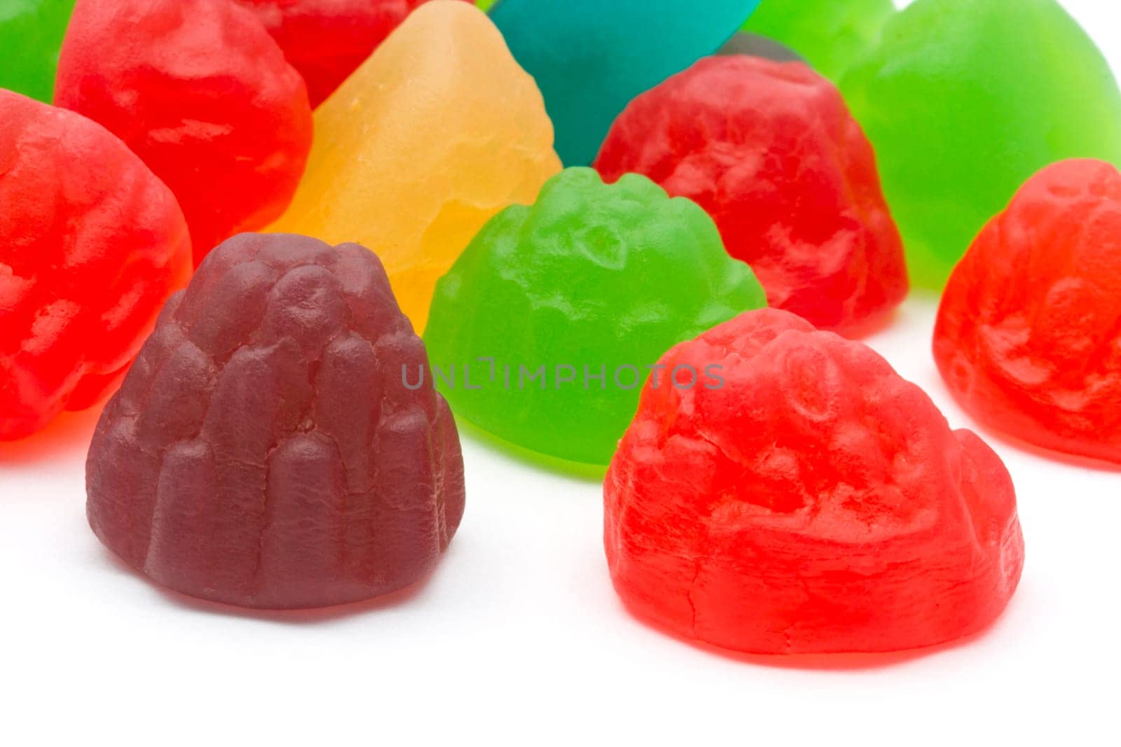 Colorful fruits candy closeup on white background