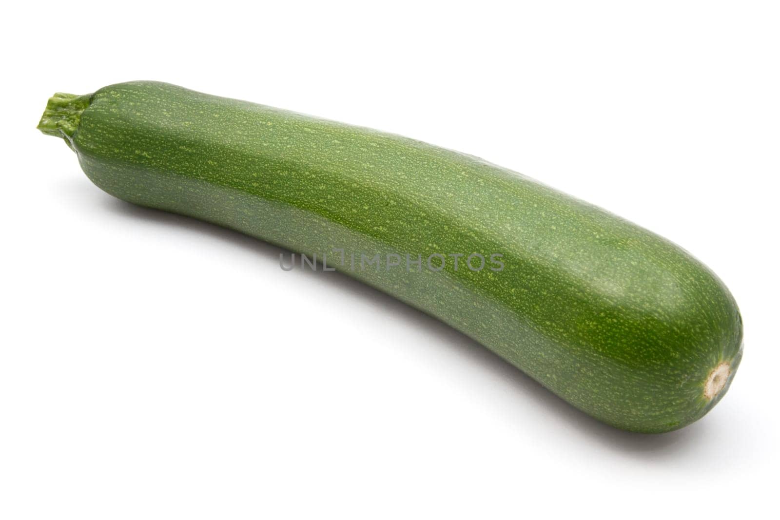green zucchini closeup on white background