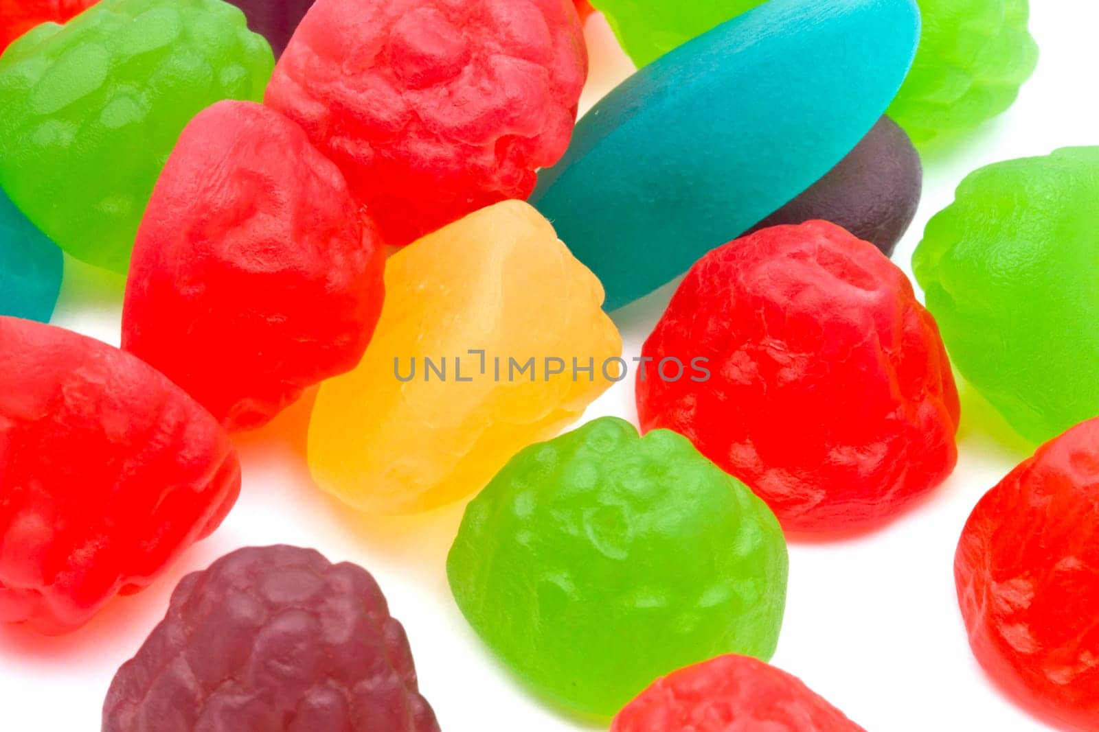 Colorful fruits candy closeup on white background