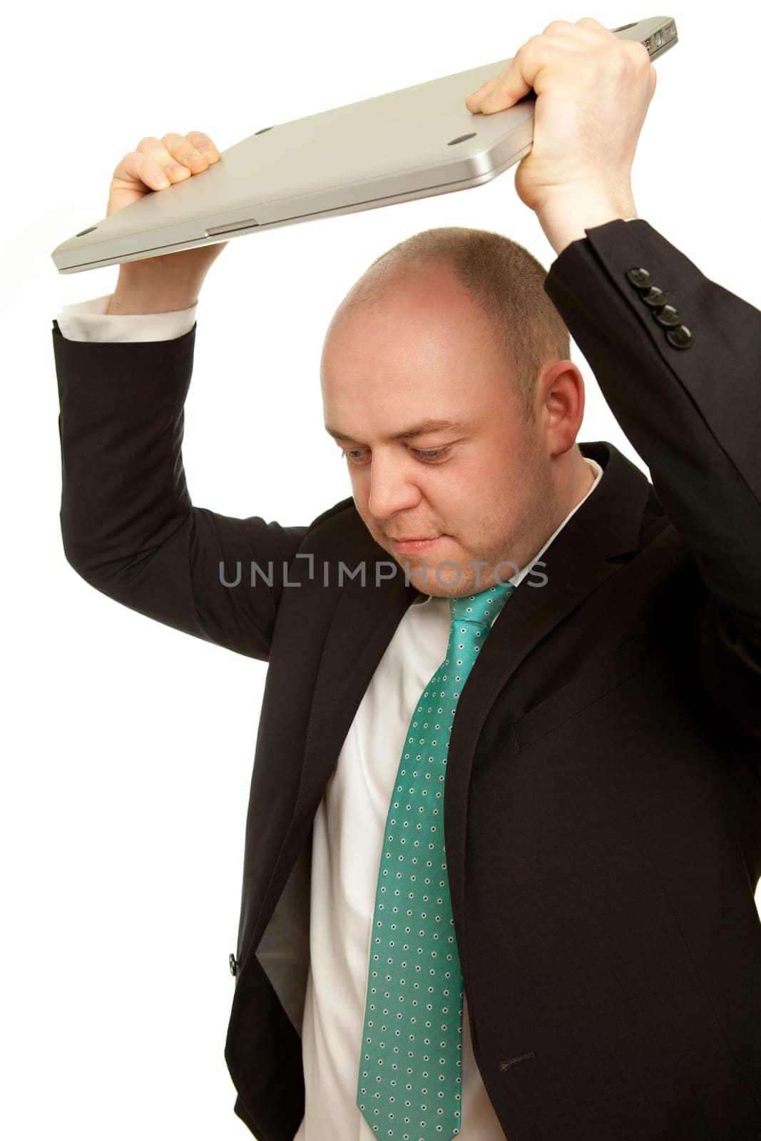 Business man throwing laptop and want to destroy it