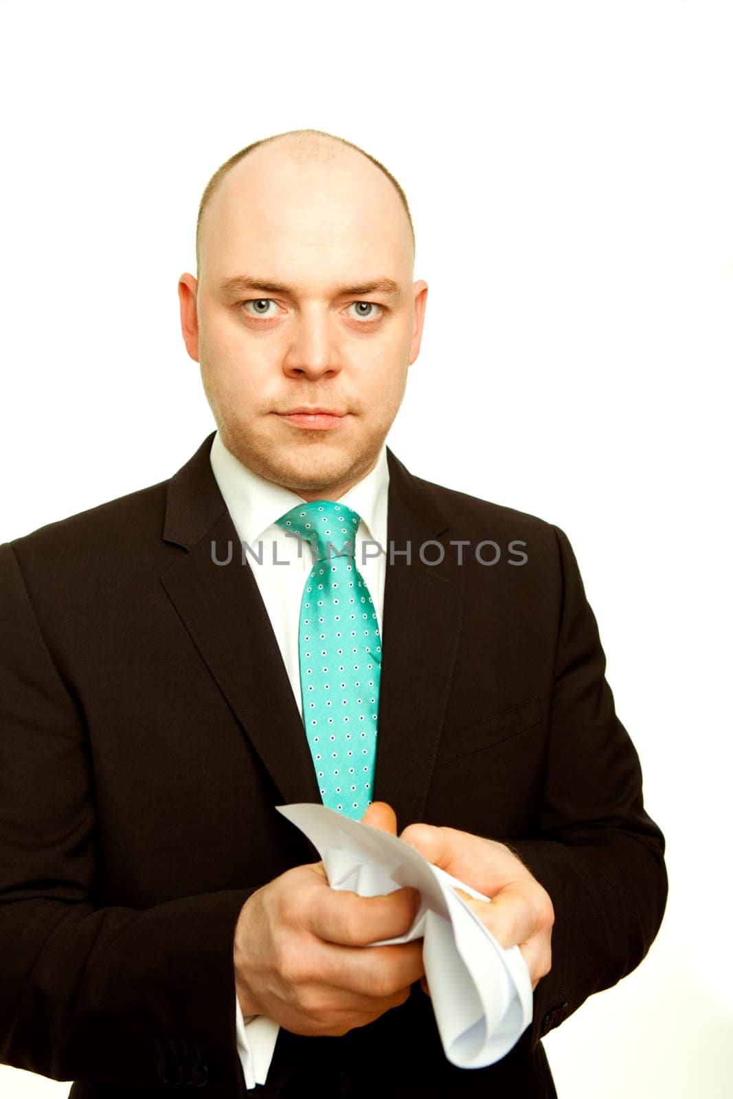 Business man crumples white blank page of paper