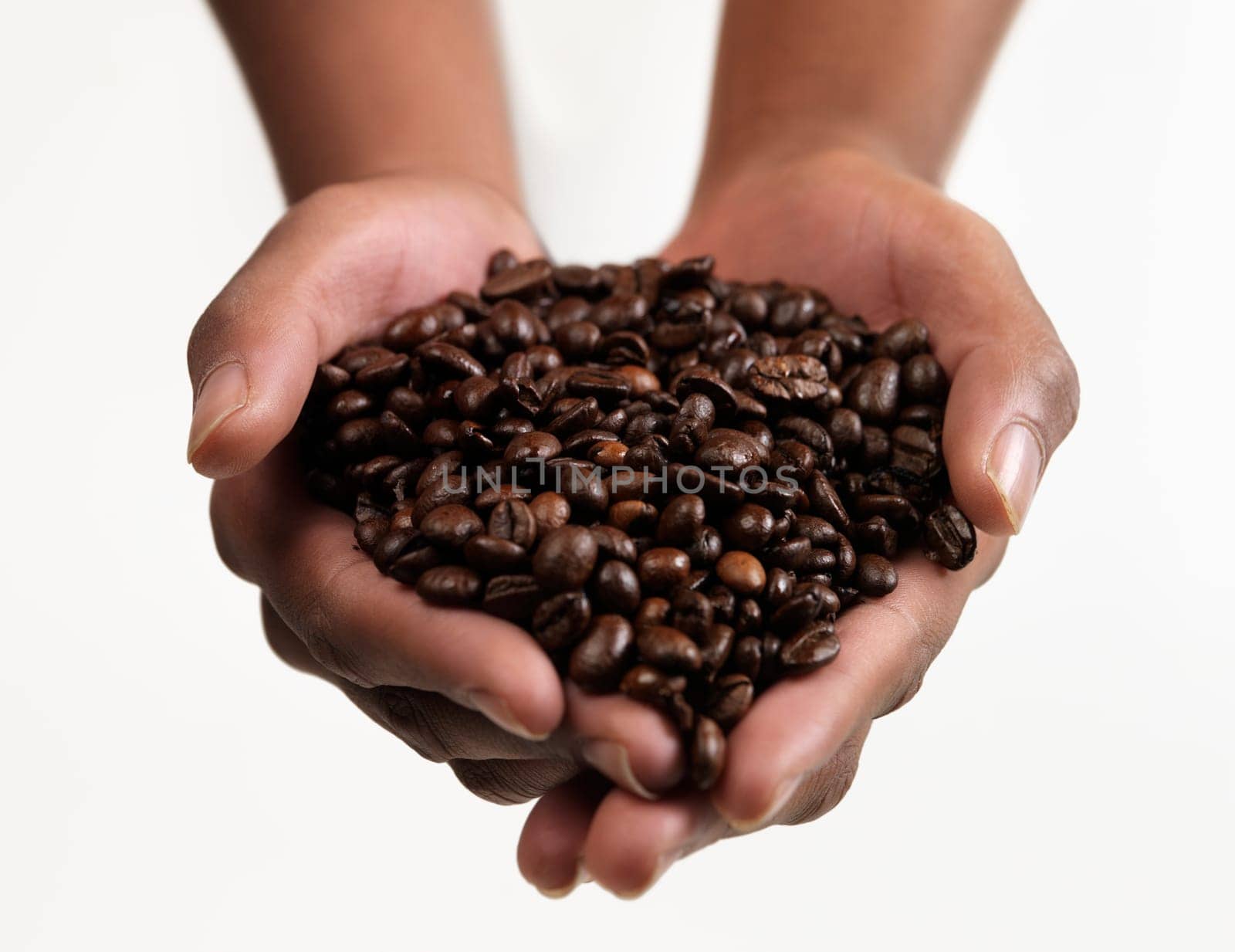 Hands holding Large group of Coffee beans