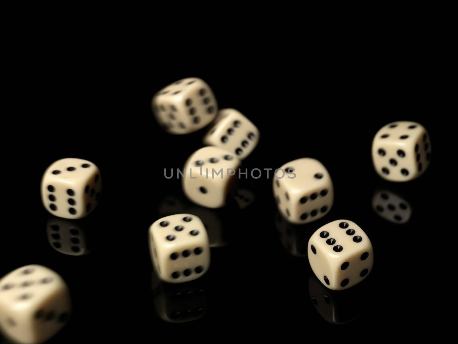Rolled dices on black background