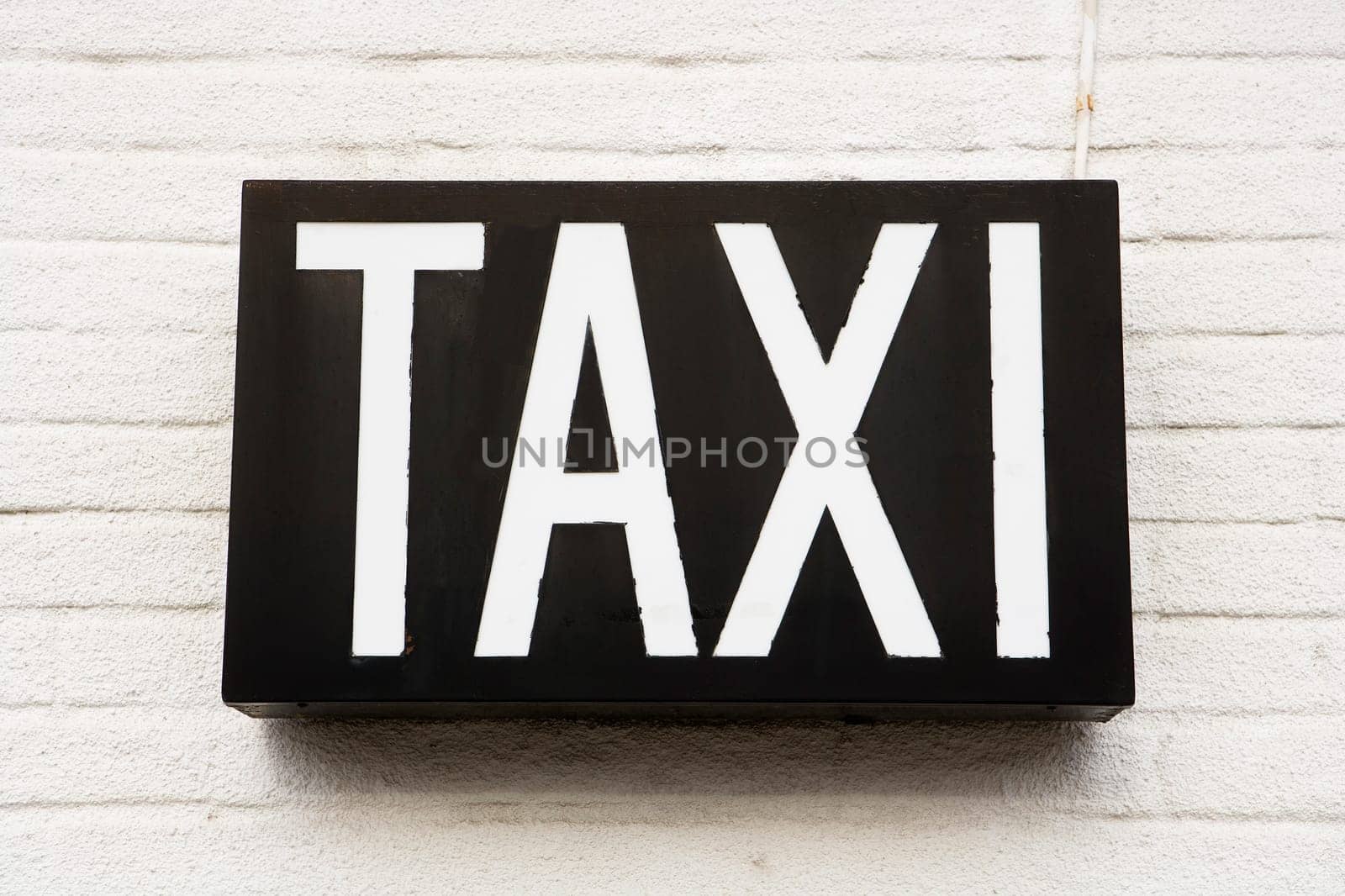 Taxi Sign on a wall