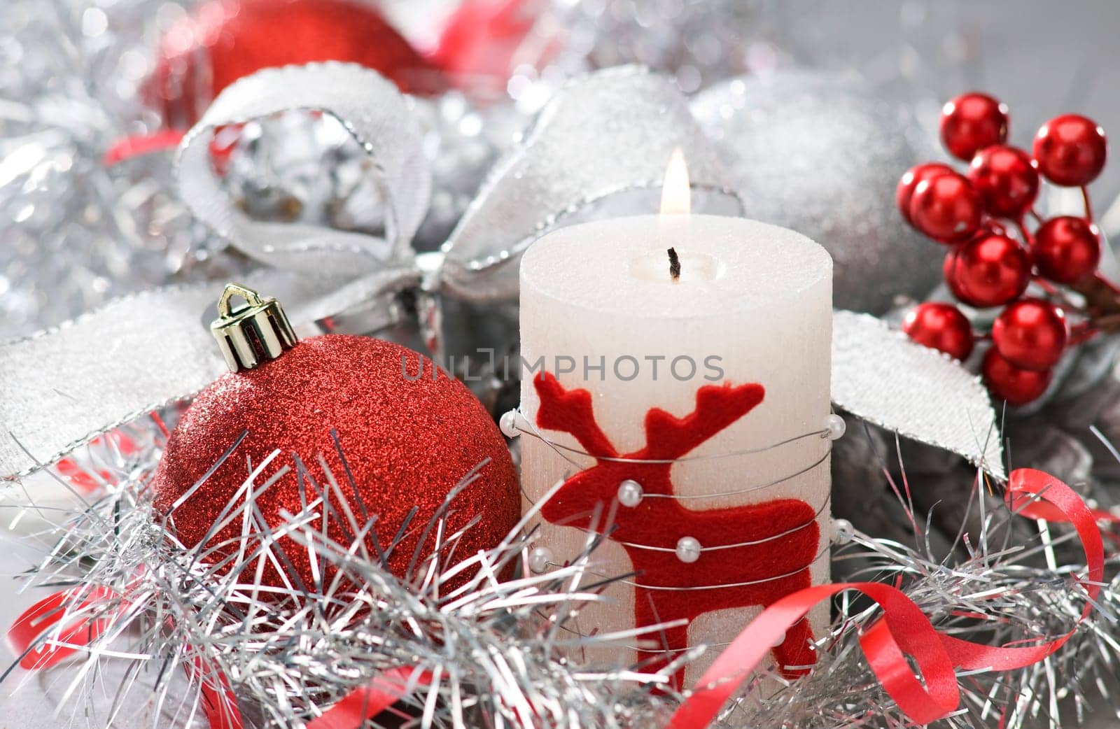 candle and christmas balls with shallow focus close up shoot