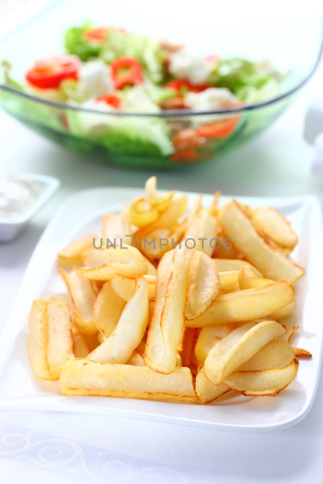 Baked potatoes with dip and vegetable salad with tunny