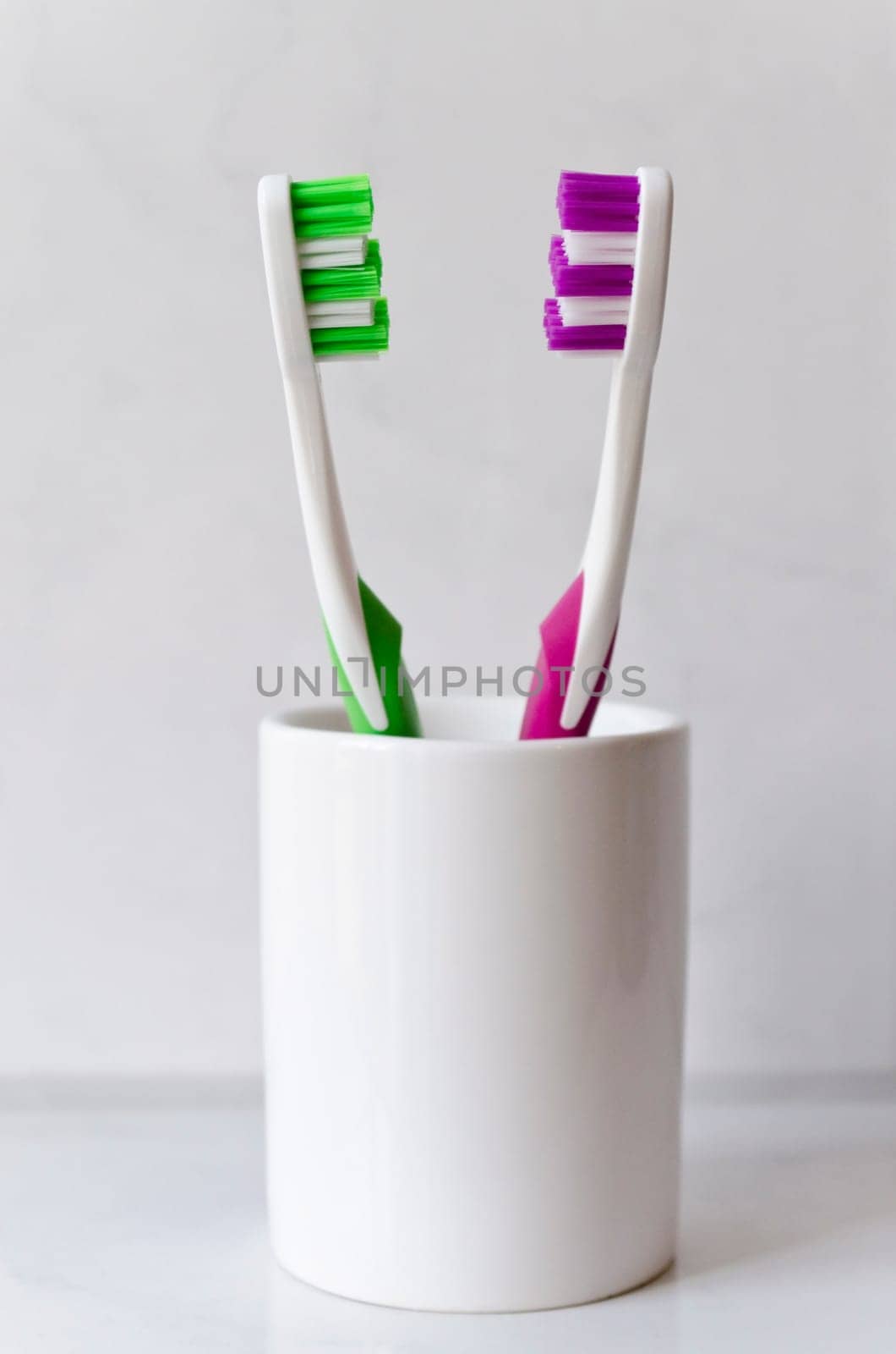 Two colored toothbrushes isolated