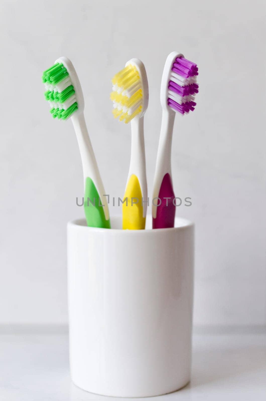Three Colored Toothbrushes Isolated