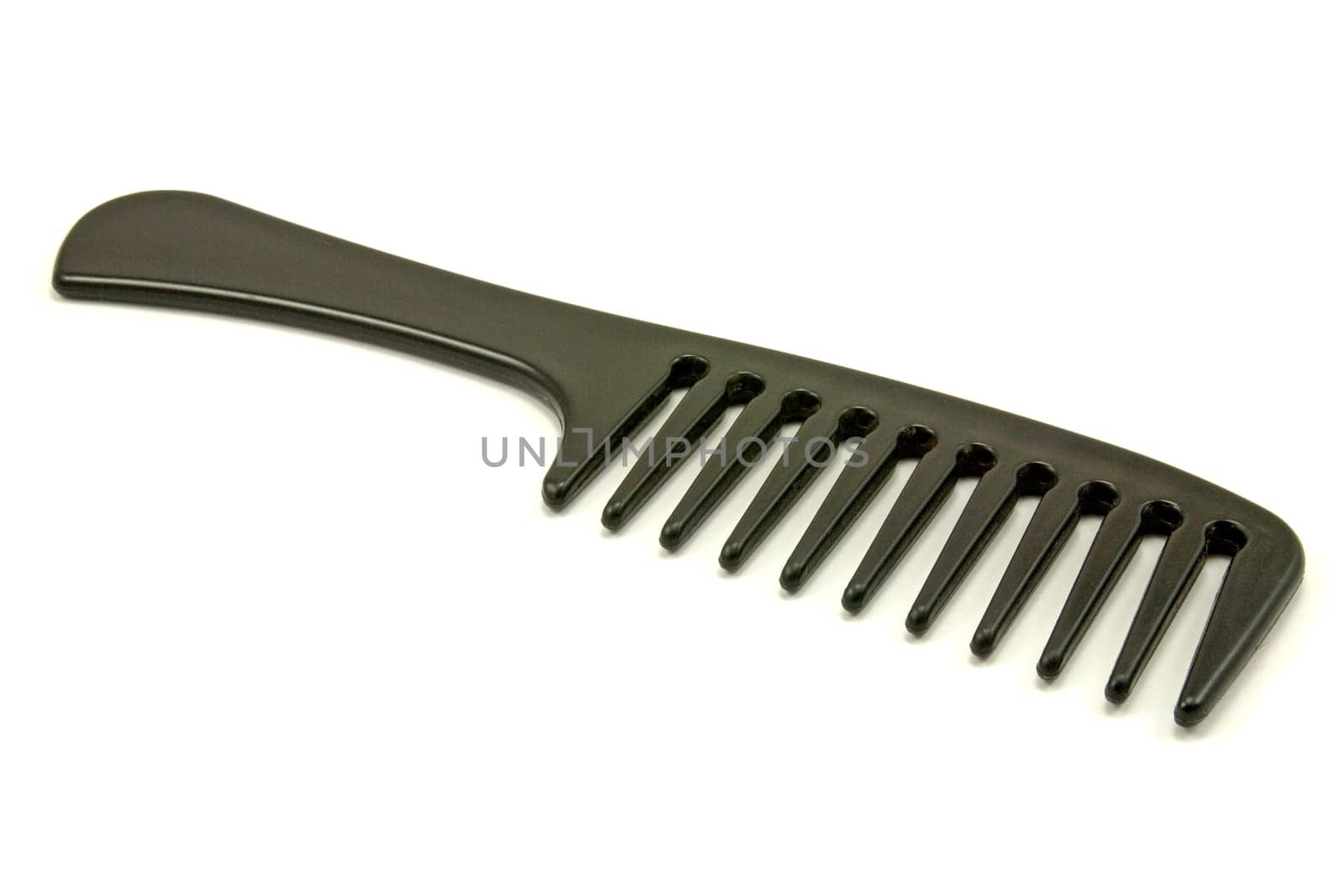 black plastic comb isolated on white background