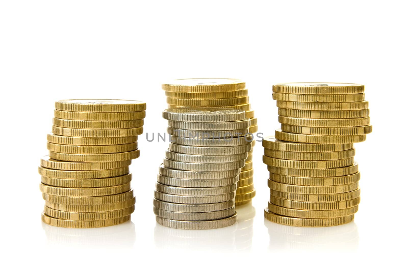 four stacks of coins over a white background