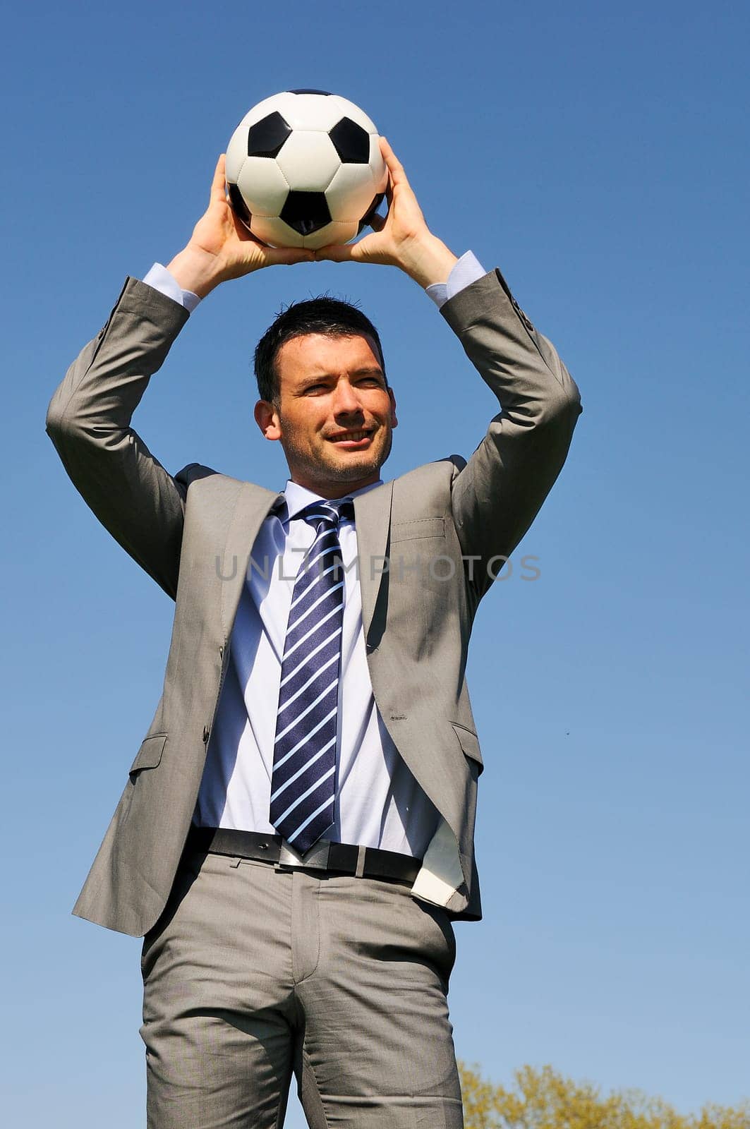 Business man coaching soccer