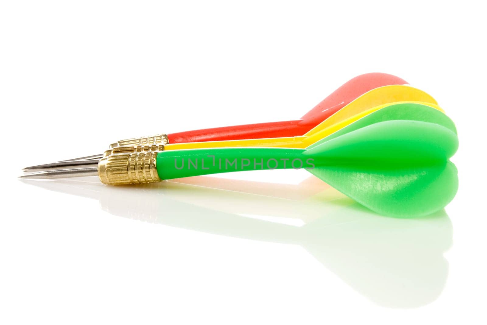 three darts with reflection on white background