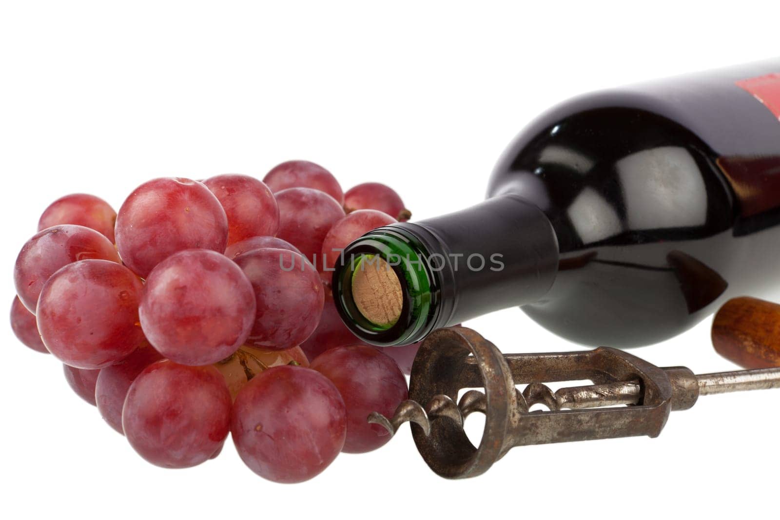 Wine bottle with corkscrew and grapes