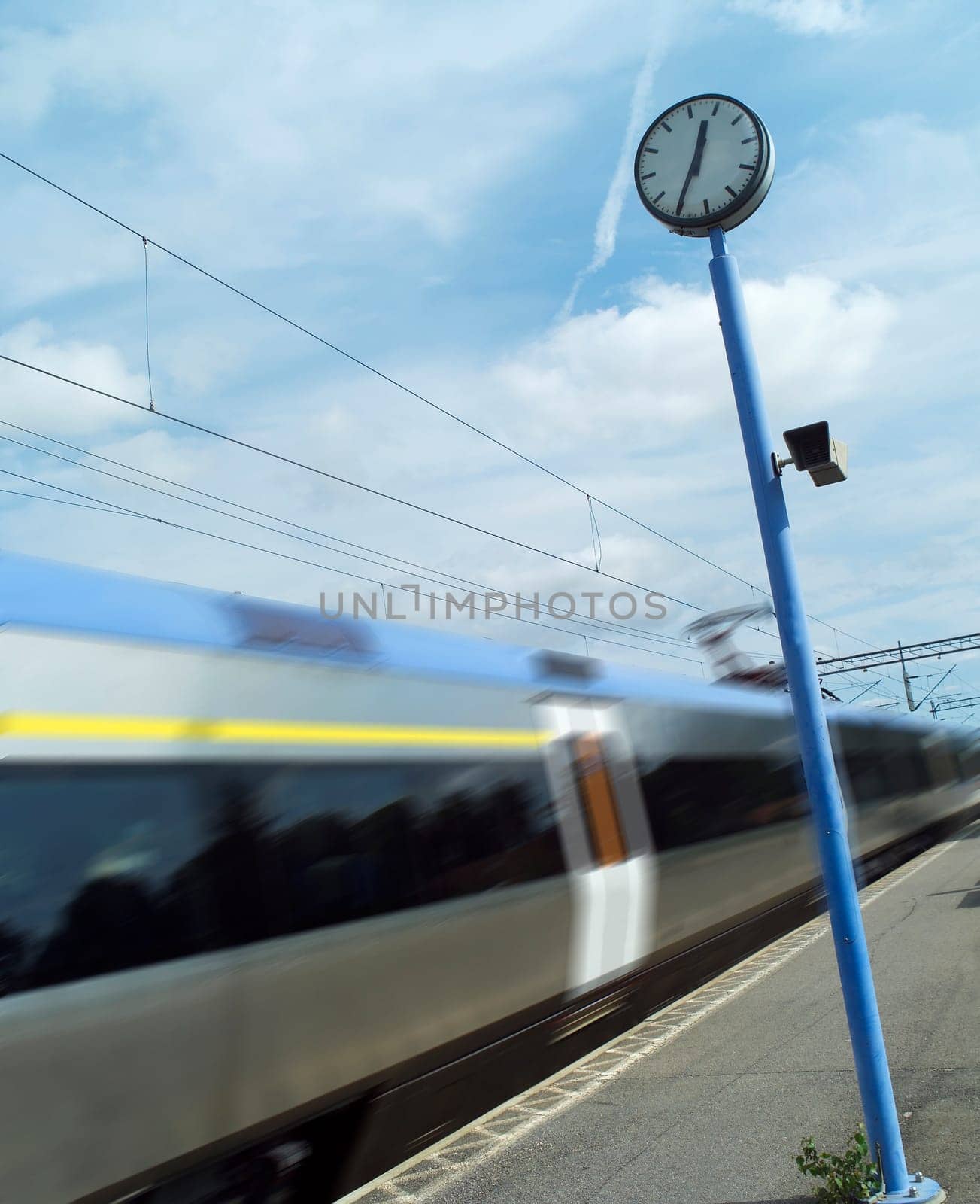 Train at the station towards blue sky