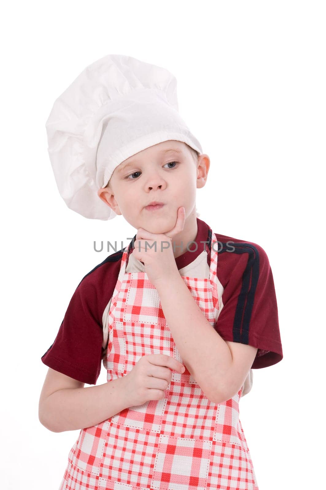 a pensive child chef isolated on white background