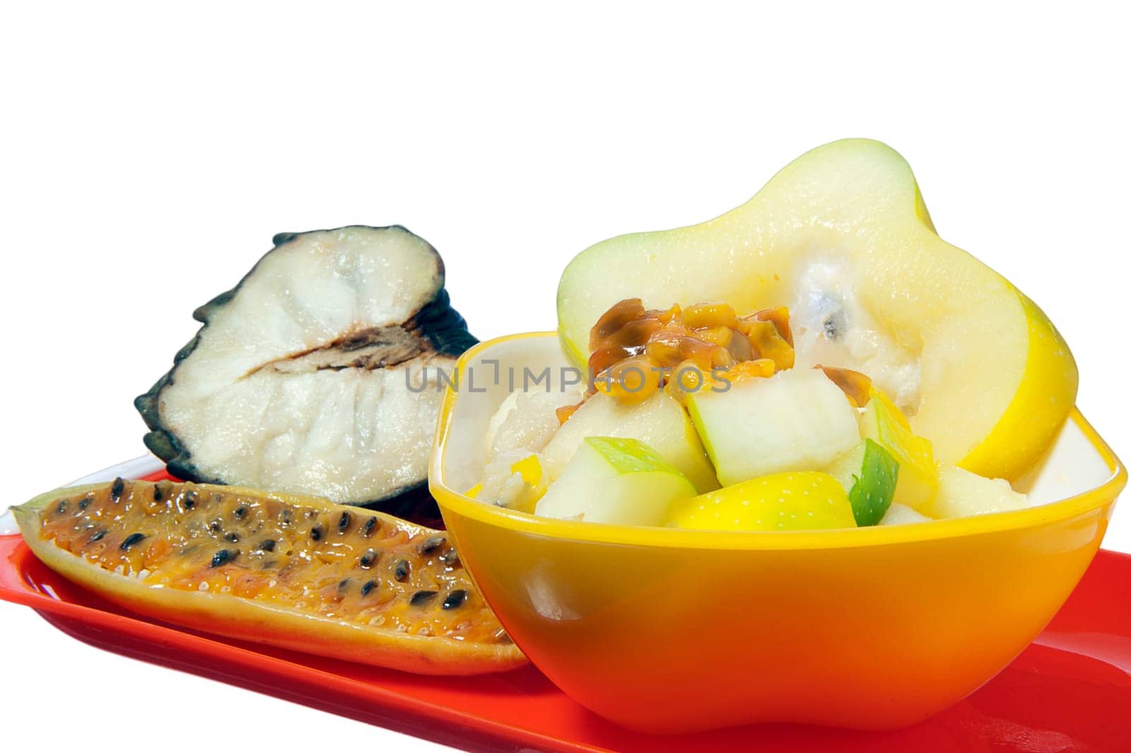 salad with tropical fruits on white background
