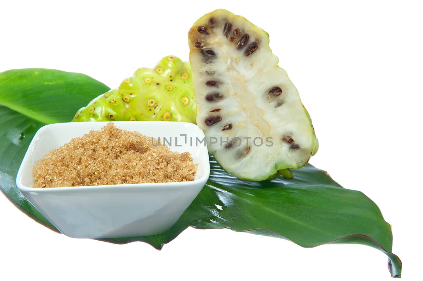 two noni fruit on white background