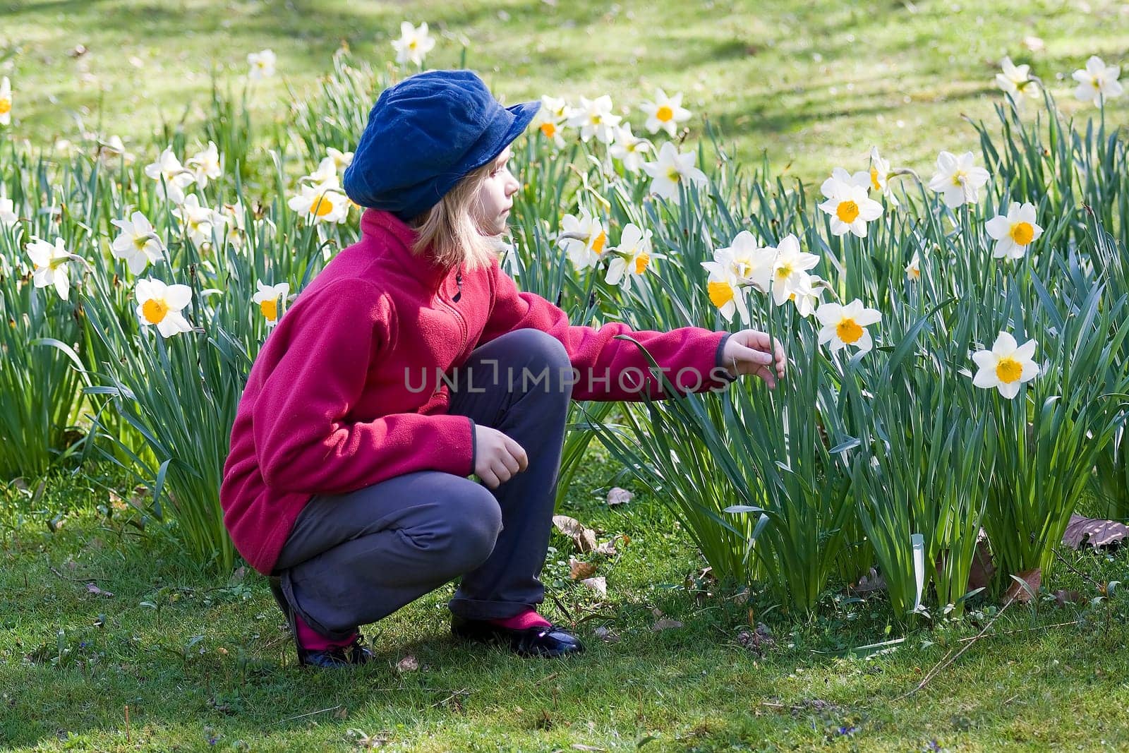 Small girl in spring garden