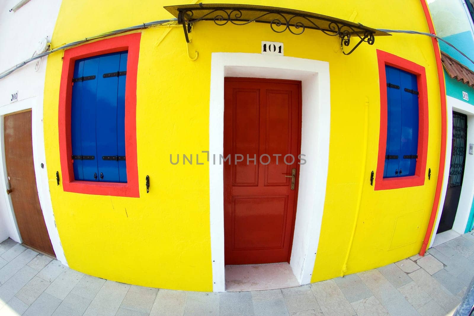 colorful facade of an old fisher house in the village of Burano near Venice