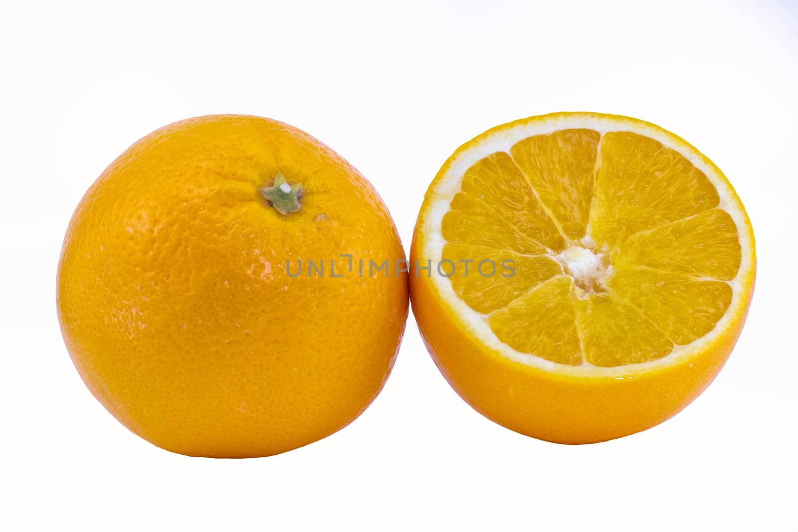 Fresh juicy oranges with leafs. Isolated on white background