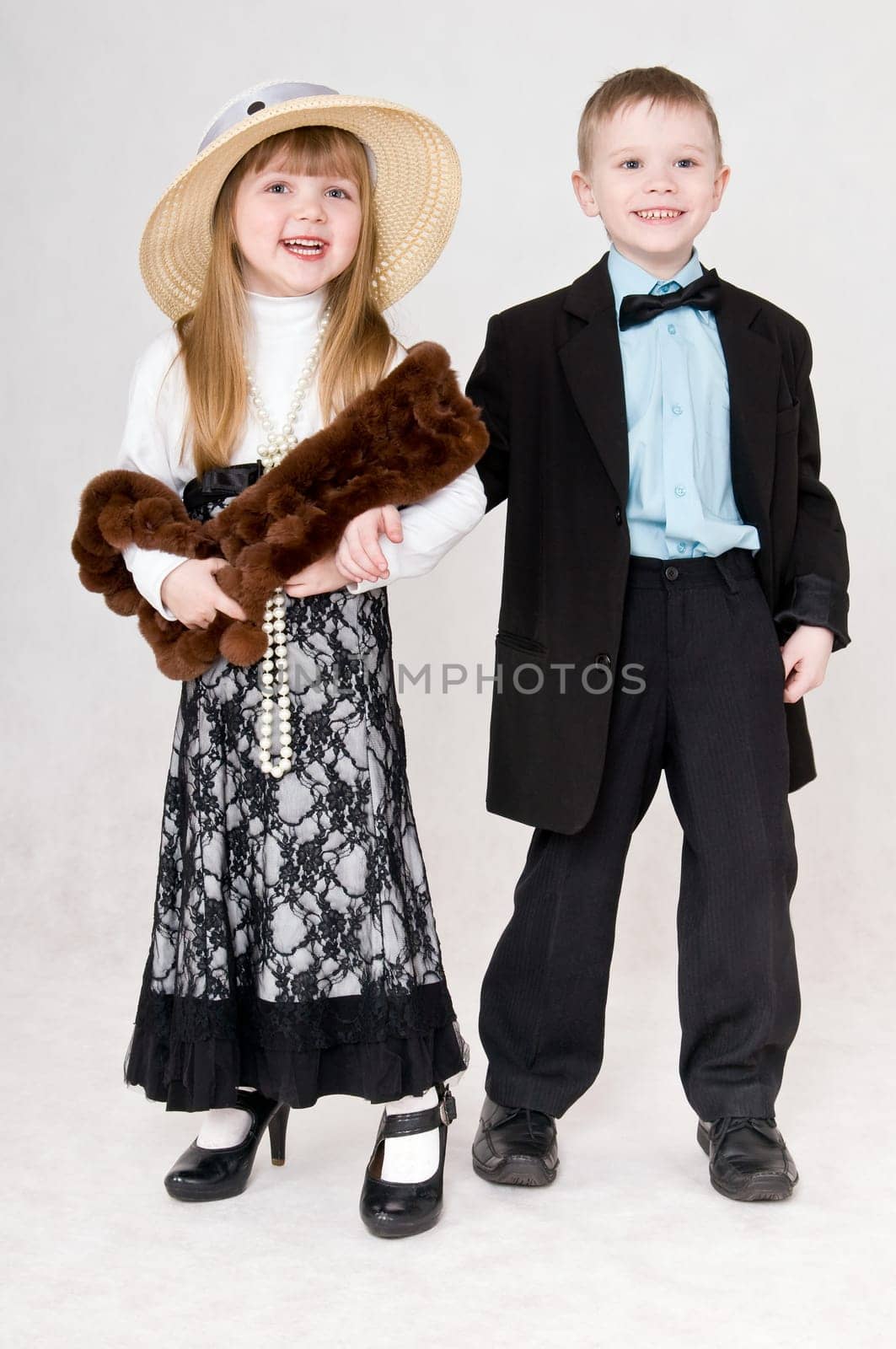 Smiling boy and girl hold each other&#039 s hand