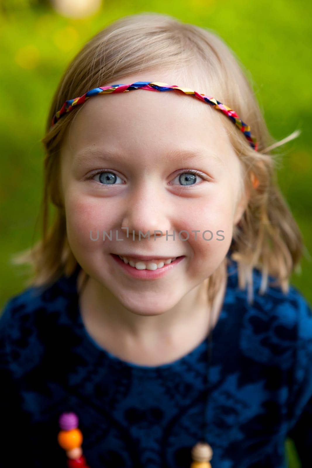 Little girl outdoors on a beautiful summer afternoon