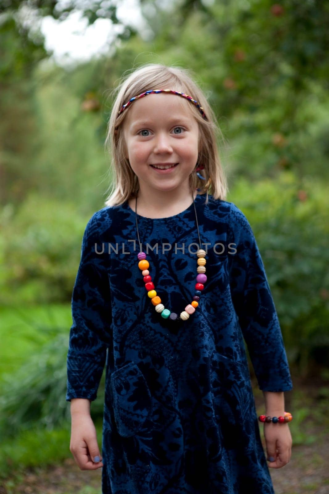 Little girl outdoors on a beautiful summer afternoon