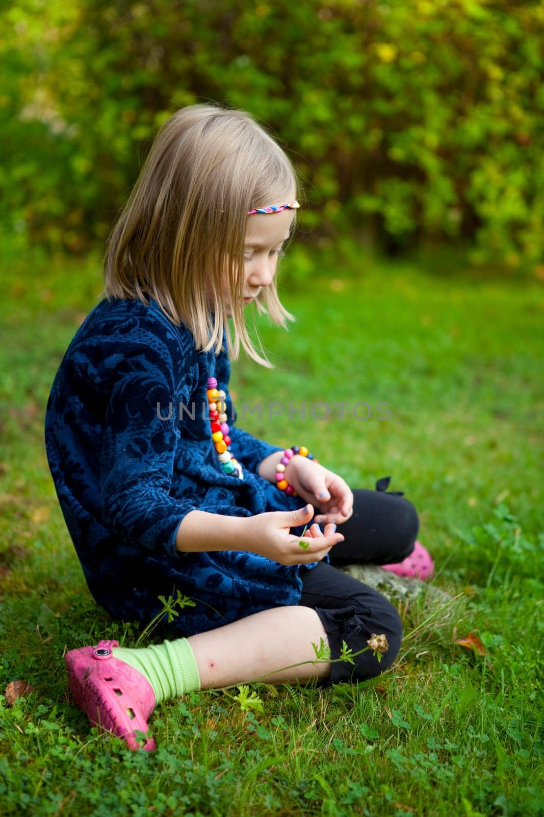 Little girl outdoors on a beautiful summer afternoon