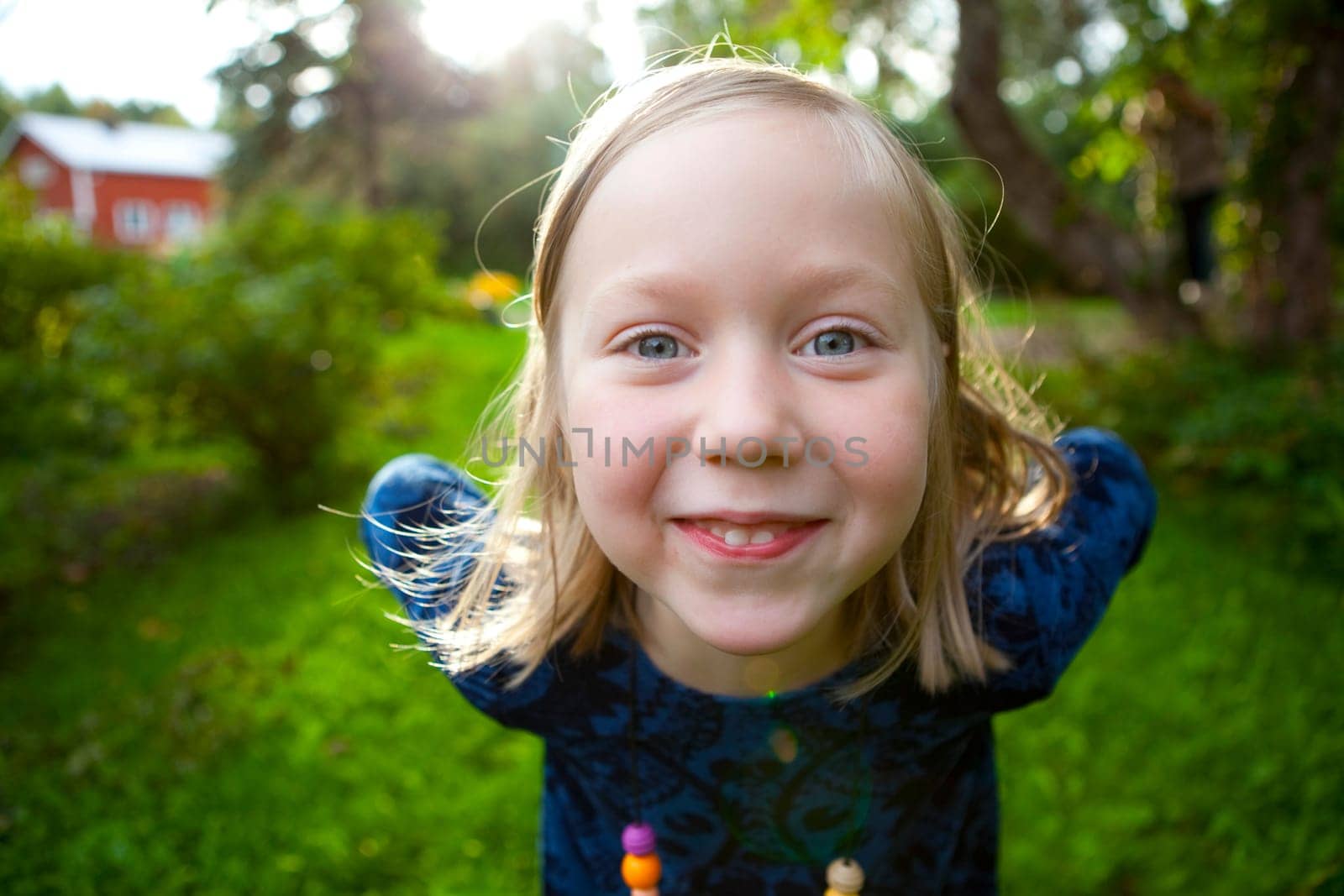 Little girl outdoors on a beautiful summer afternoon