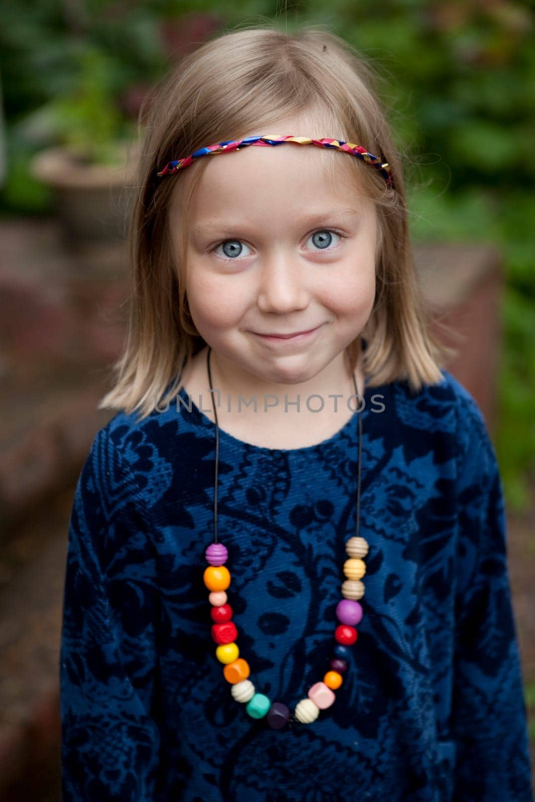 Little girl outdoors on a beautiful summer afternoon