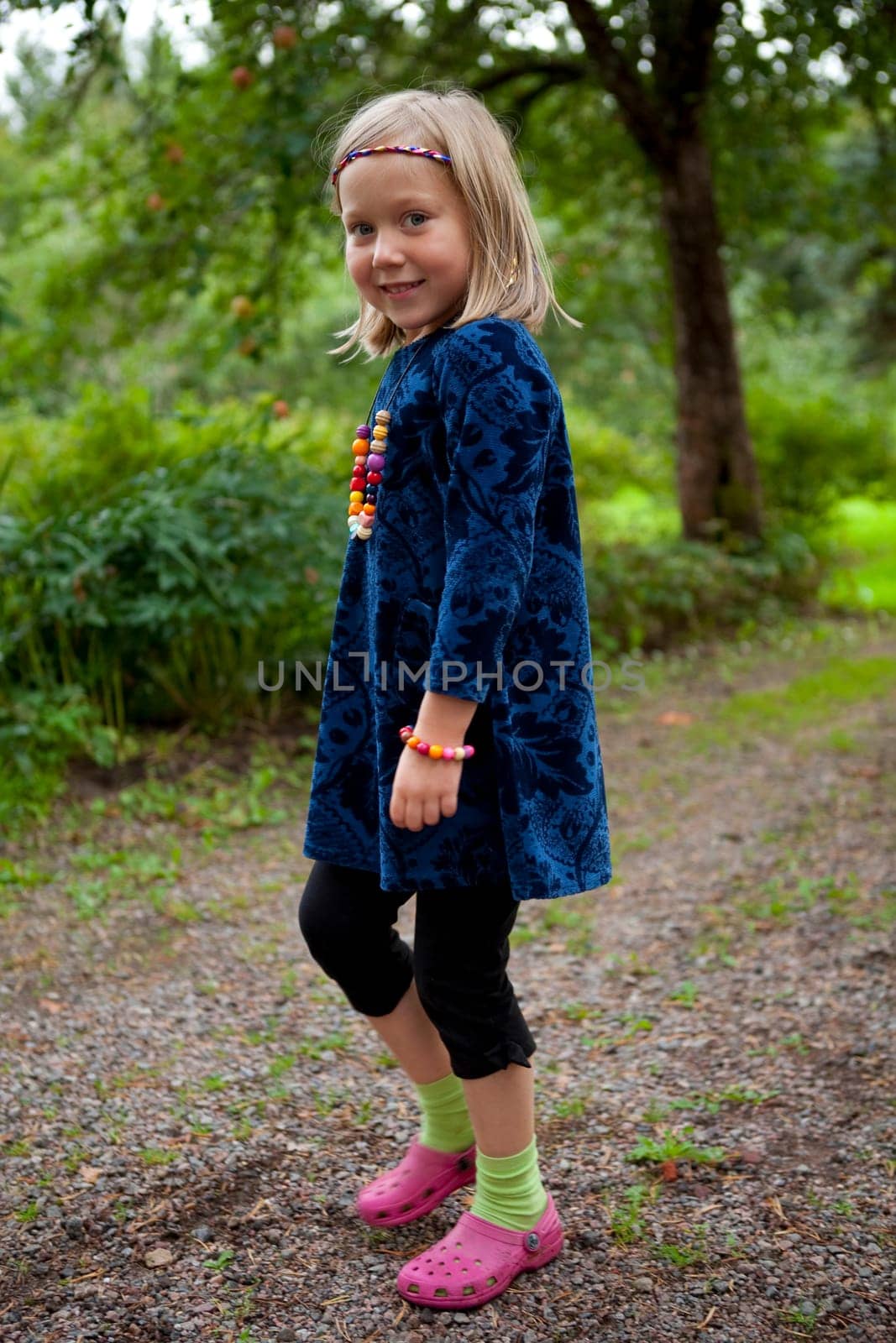 Little girl outdoors on a beautiful summer afternoon