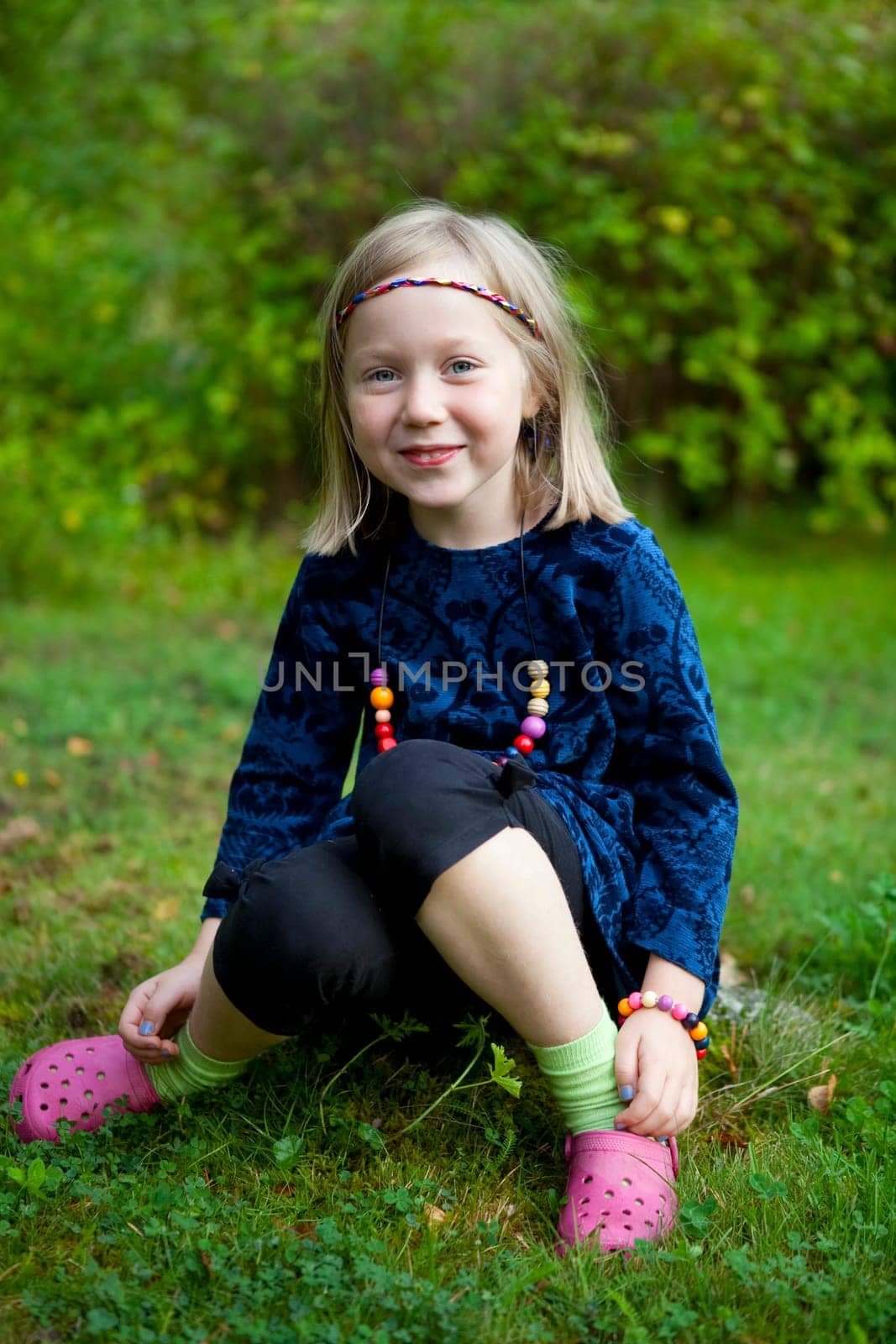 Little girl outdoors on a beautiful summer afternoon