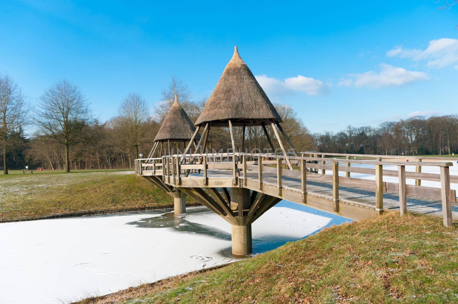 typical footbridge over a frozen canal