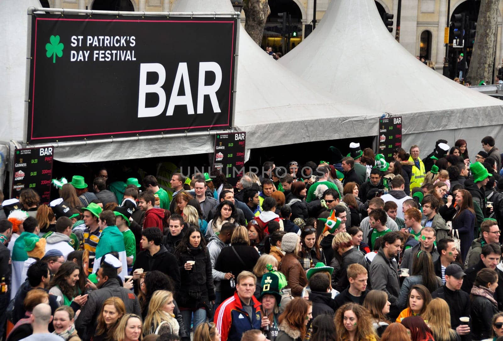 LONDON - MARCH 18: The crowd during the St Patrick&#039 s Day Parade and Festival at Trafalgar Square on March 18, 2012 in London, UK.