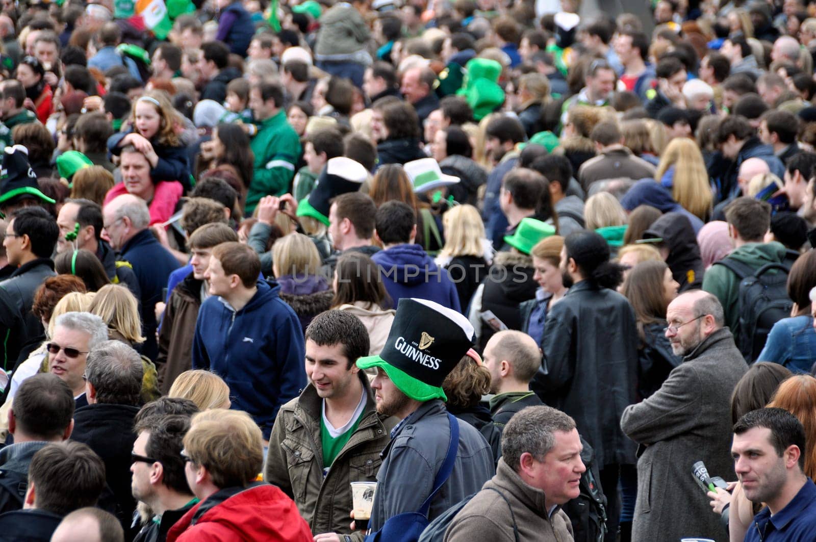 LONDON - MARCH 18: The crowd during the St Patrick&#039 s Day Parade and Festival at Trafalgar Square on March 18, 2012 in London, UK.