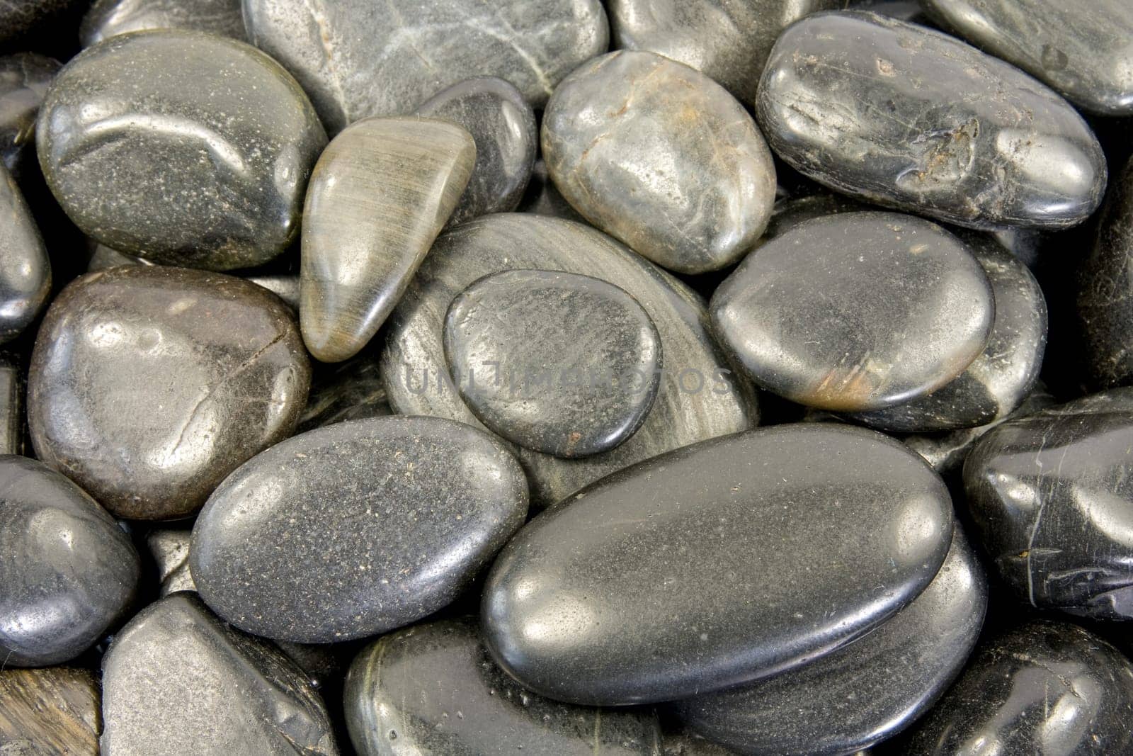 close up of black stones background (texture).